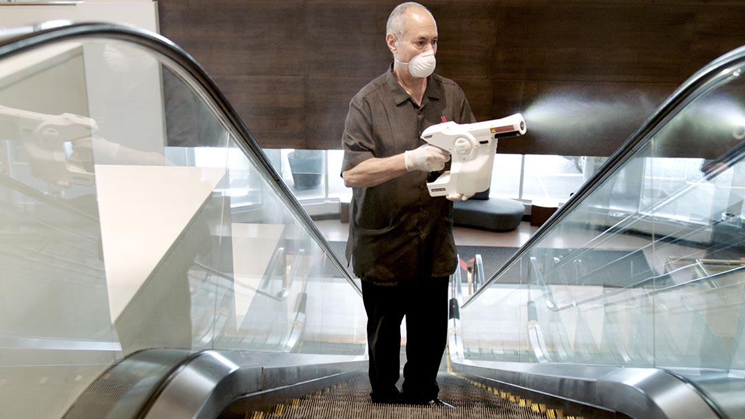 Man disinfecting the elevators at a Marriott International Hotel